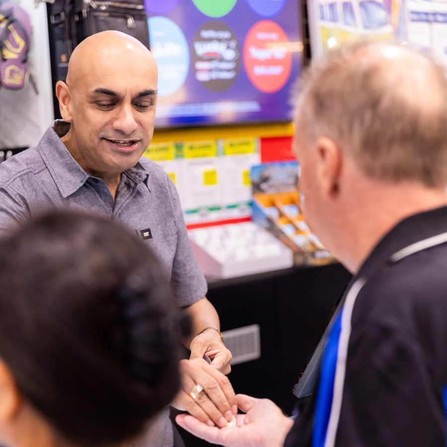 Millan assisting a customer in store