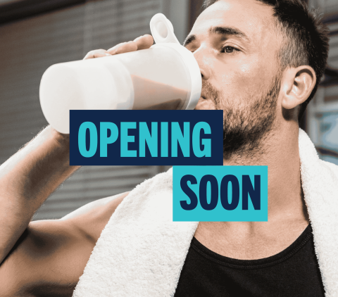 Opening Soon man drinking protein shake